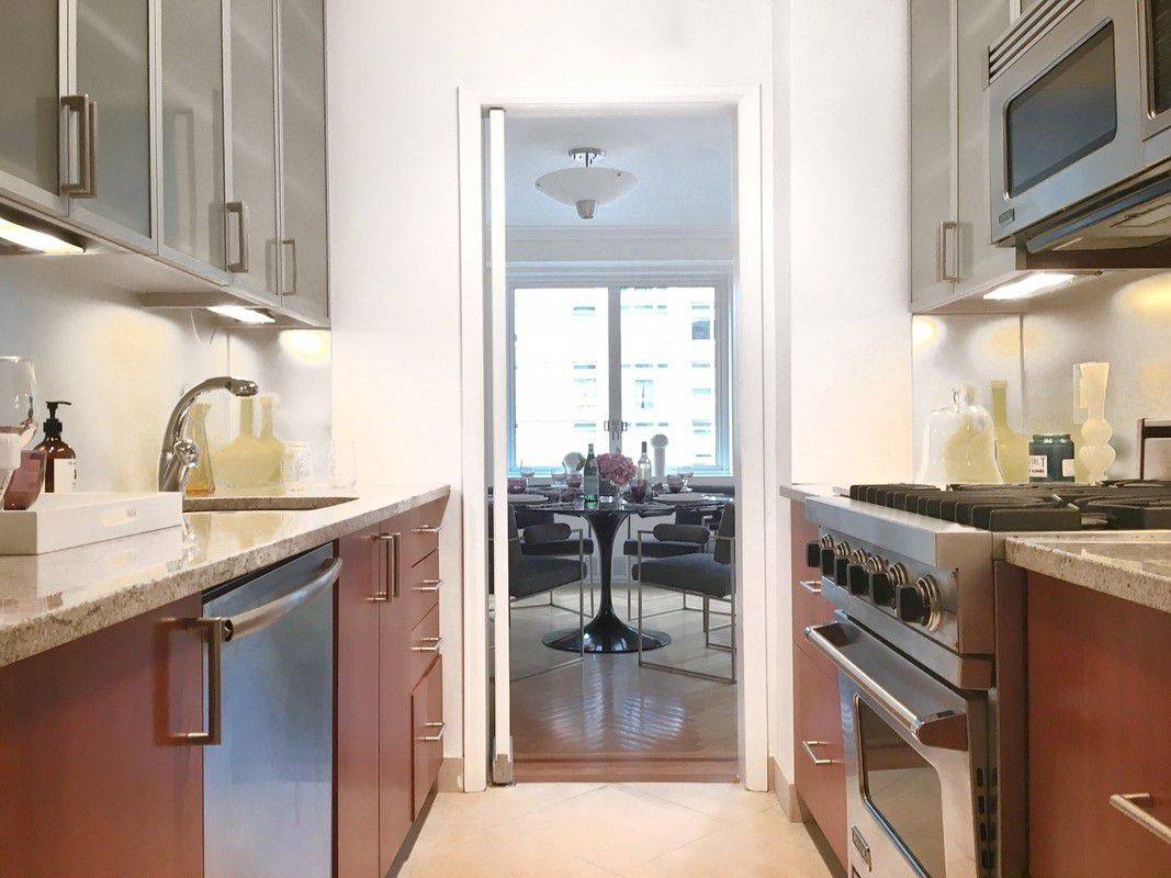 Spacious, Elegant and Sun-filled Corner 3 Bedroom w Terrace and Alcove DR + W/D in Premier Lenox Hill White Glove Concierge Bldg w Garage & Gym