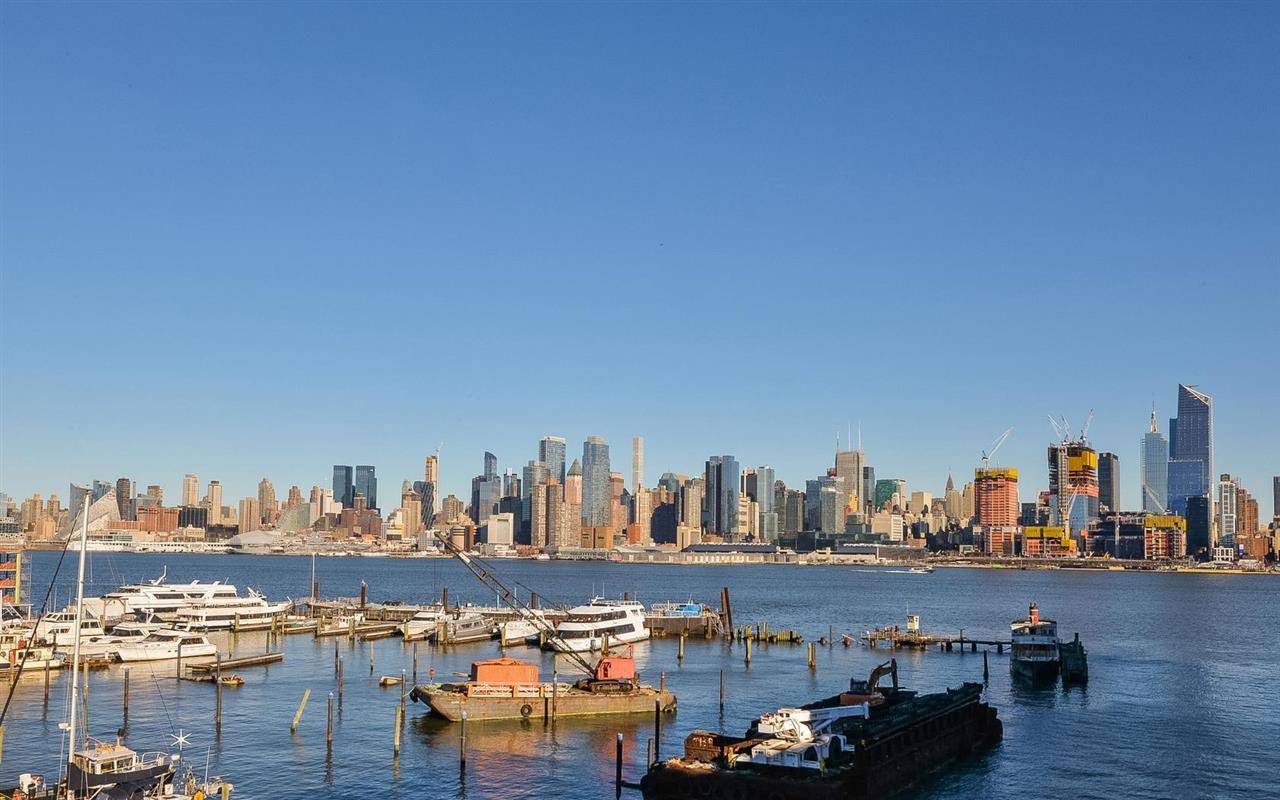 Amazing waterfront duplex with custom built-ins throughout and spectacular views of Midtown Manhattan