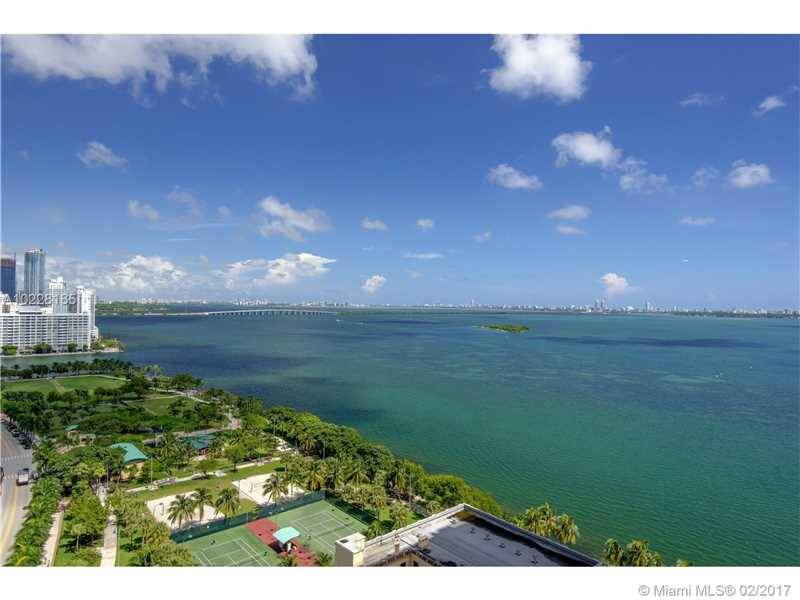 Enjoy the sumptuous Miami skyline and water views seen from all rooms in this high floor 3/3 split plan unit with 1739 sq