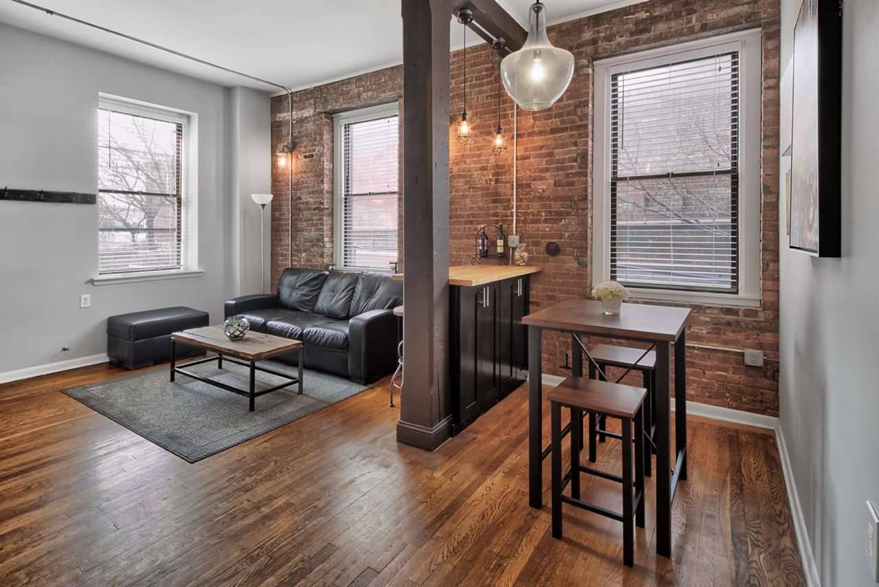 Exquisite fully renovated industrial loft home boasting 12 foot ceilings in the midst of Downton Jersey City