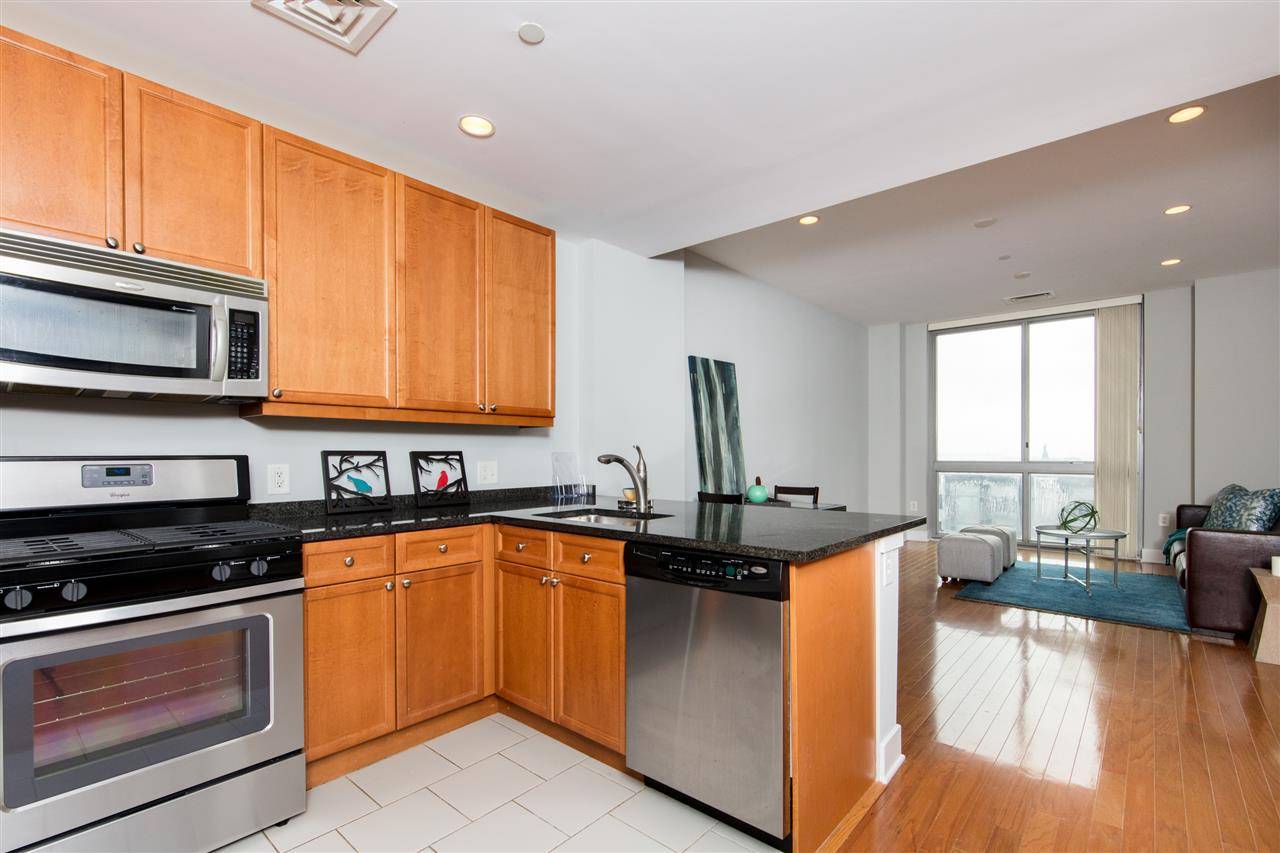 Views of the Statue of Liberty can be seen from this 1 bed 1 bath condo at Gulls Cove in Downtown Jersey City