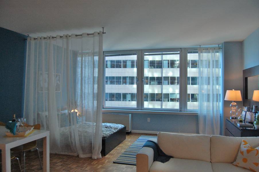 FIDI - Spacious Studio with Full Time Doorman, Located Close to Train Access and Seaport - No Fee!