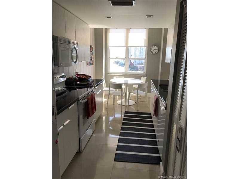 Great Corner unit has a large balcony and beautiful views in a one of the best location within the exclusive Island of Brickell Key