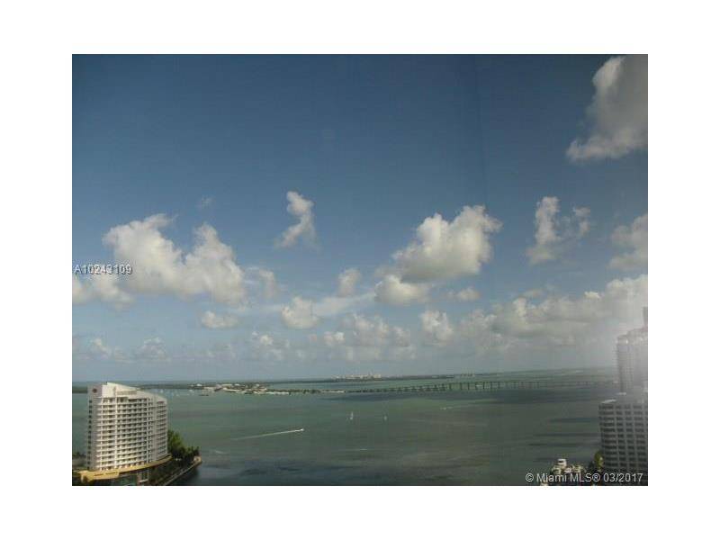 Enjoy stunning Direct Unobstructed water views from this 3/2 corner unit offered FULLY FURNISHED