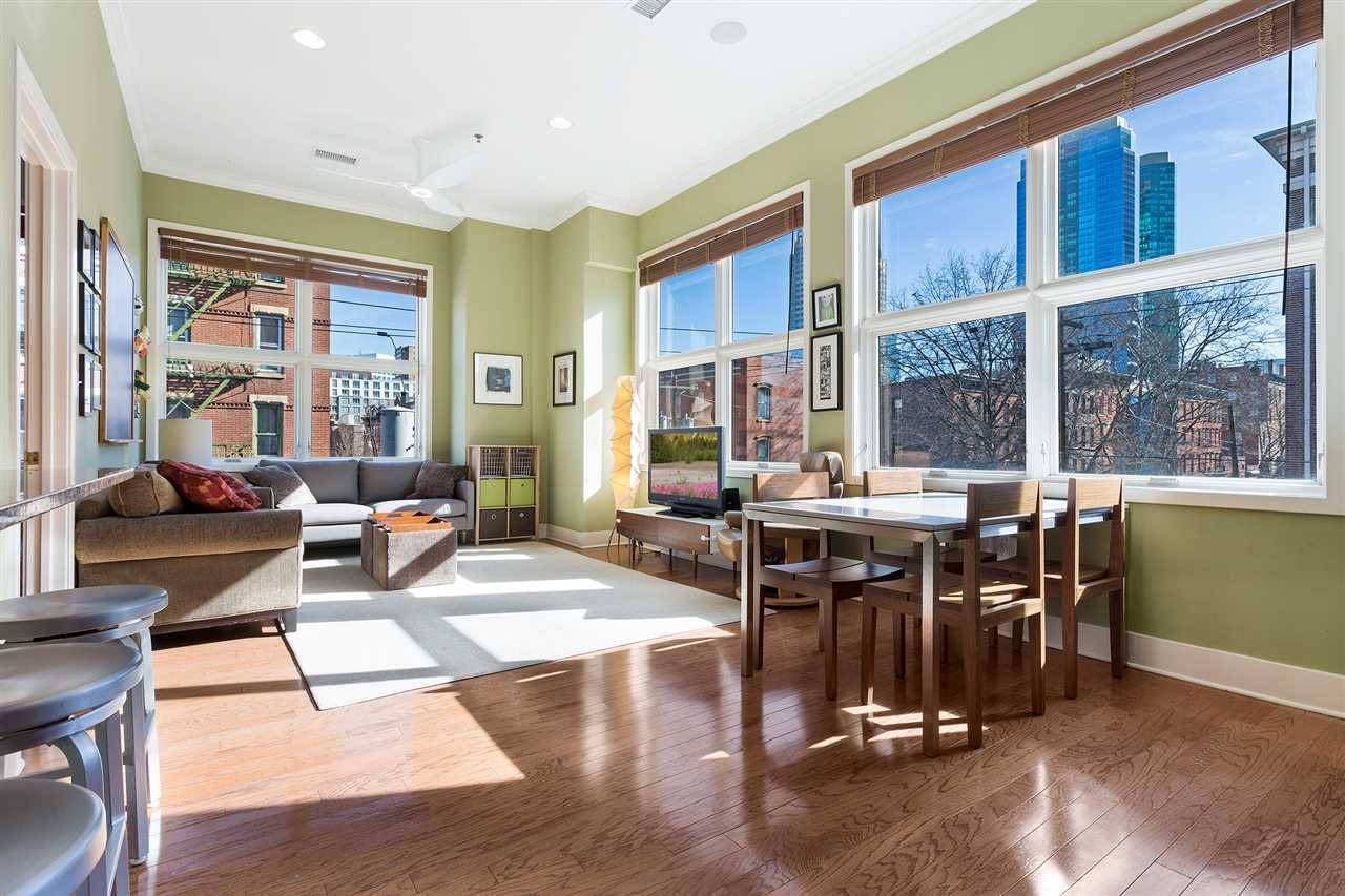 Bright and spacious Paulus Hook two bedroom unit with east facing exposure - views of Liberty Tower from living room