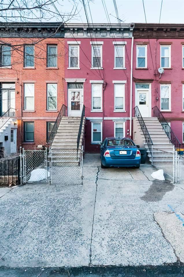Very rare 2 family Brick row house with parking in Journal Square's prestigious 