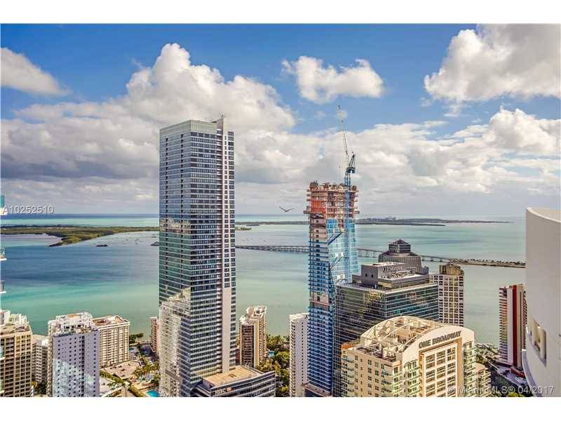 Enjoy magnificent panoramic views of the ocean & skyline from one of four unique balconies at this one of a kind corner Penthouse