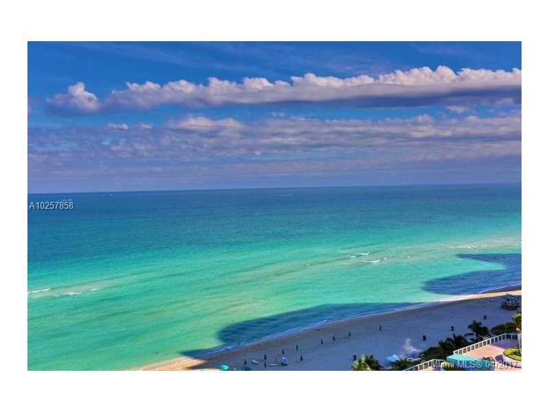 MILLION DOLLAR VIEWS FROM THIS FABULOUS HIGHLY UPGRADED OCEAN FRONT CONDO LOCATED ON SUNNY ISLES BEACH