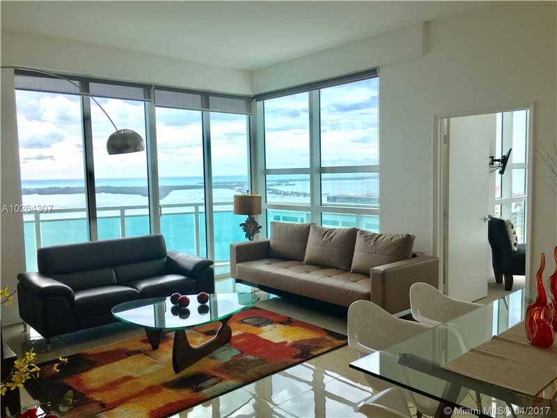 Gorgeous fully furnished apartment with unobstructed bay views and 2 parking spaces
