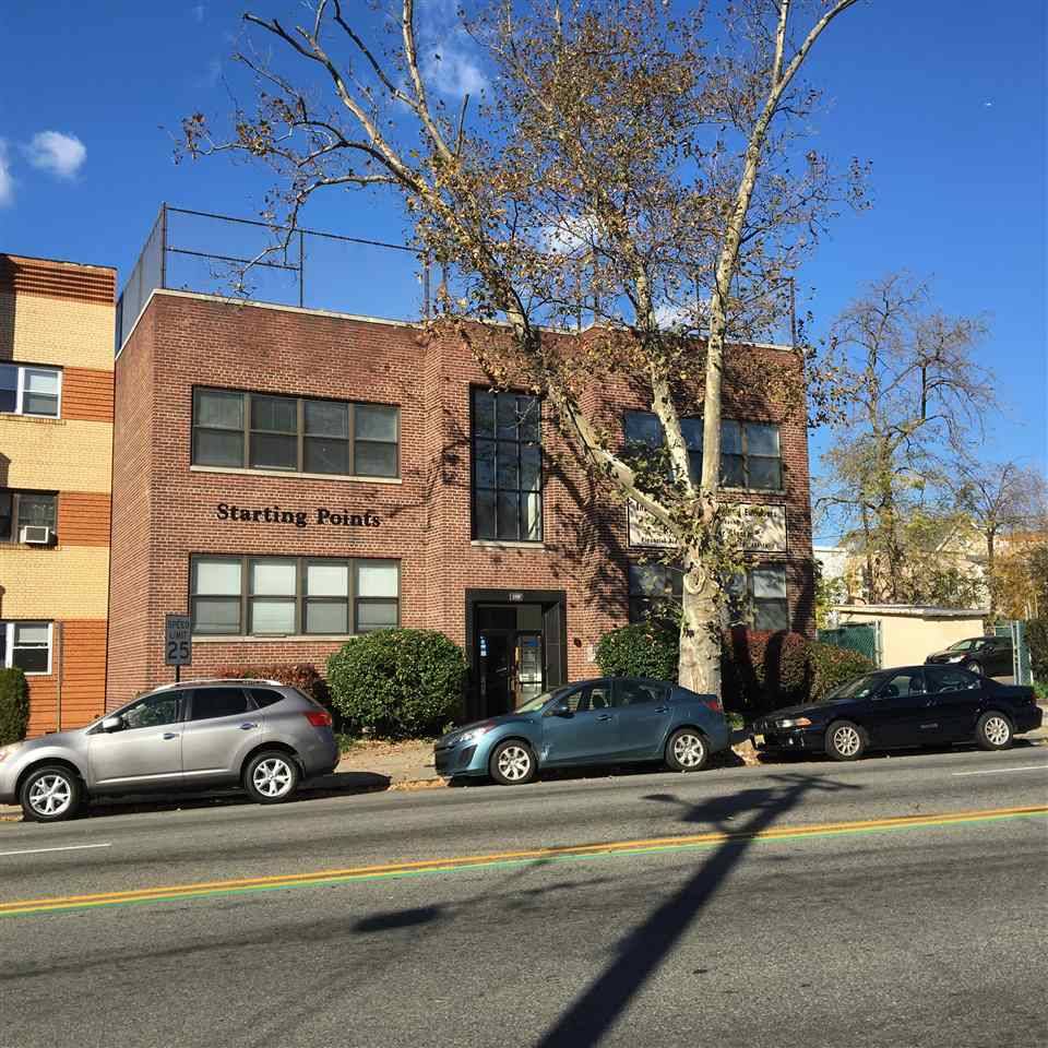 Investment/Development opportunity- Approx 8762 sf of land with street to street access and containing a 2 1/2 story office building with approx