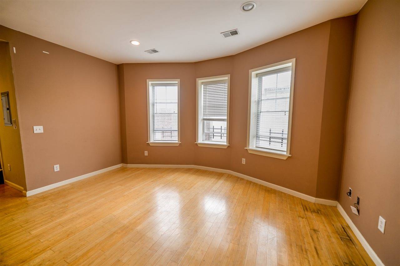 Charming 2 bed/2 bath home plus den on tree-lined Reservoir Ave in Jersey City Heights