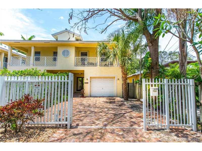 Gated Key West style town home on a quiet tree lined street in Coconut Grove