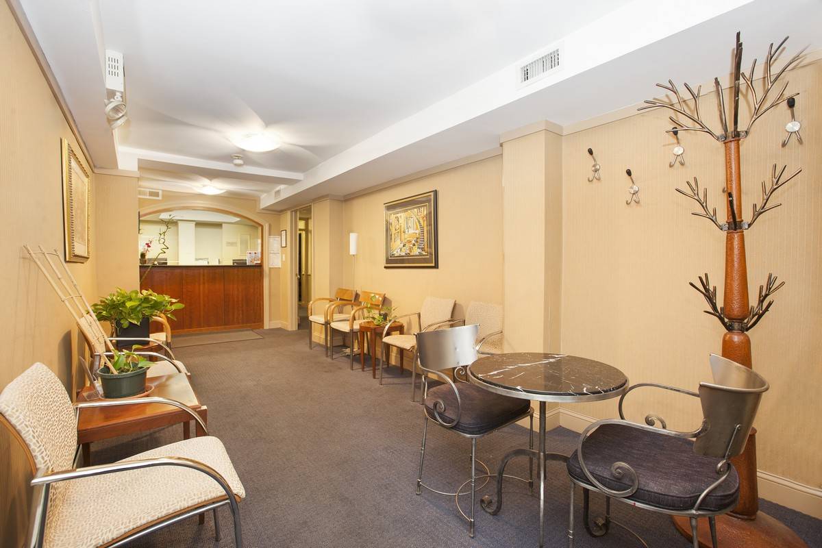 Just Listed! 212 E 70th Street 8 room spacious medical office in a charming condo brownstone building