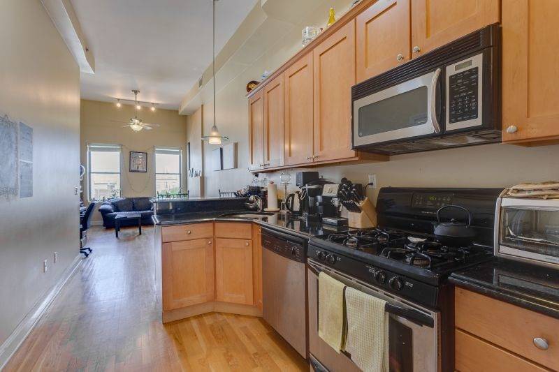 Light filled rooms and beautiful gleaming hardwood floors make this unit a 