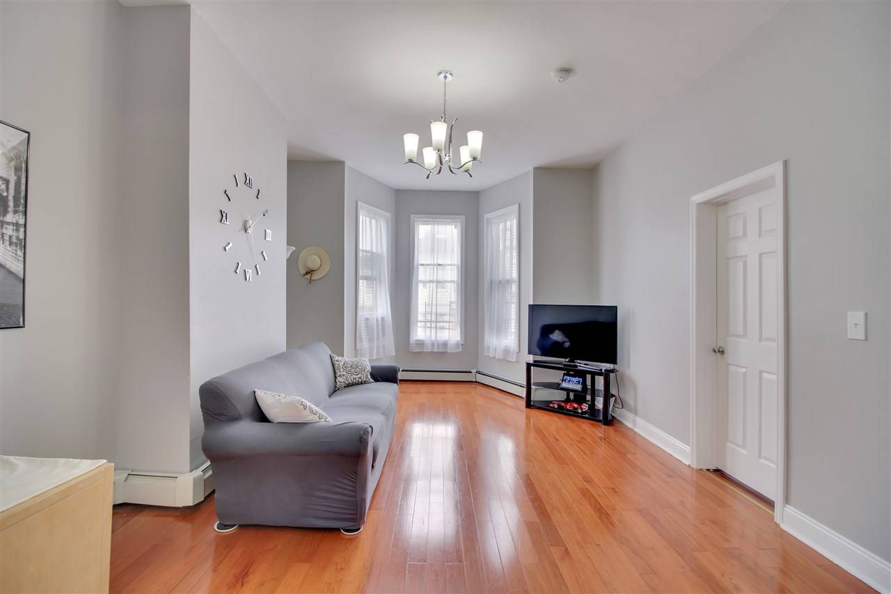 Recently updated and upgraded three bedroom one bath home flooded with natural light in one of the hottest neighborhoods around - Jersey City Heights