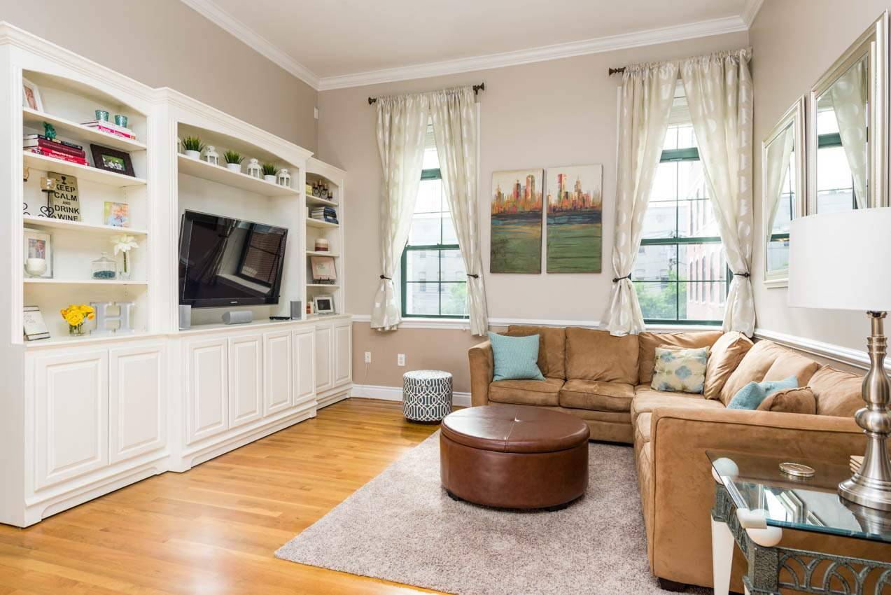 High ceilings and over-sized west facing windows greet you in this spacious open and bright 2BR/2BA condo with all the modern touches you expect