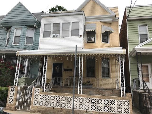 Great 2 family home featuring 3 bedrooms on 1st floor and 3 bedrooms and a bonus room on second floor
