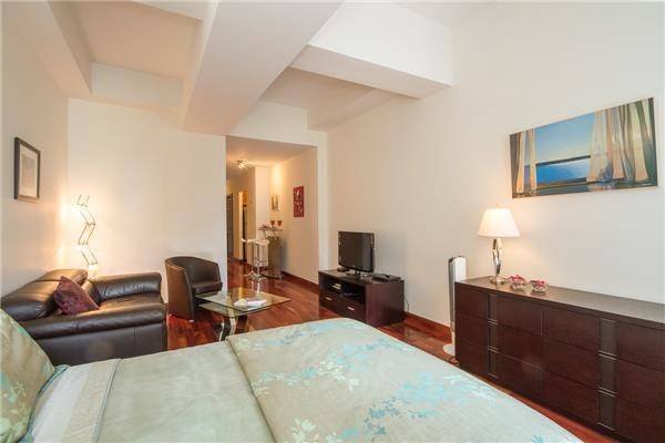 Elegantly furnished large junior one, high ceiling with lots of closets at 99 John Condo with amazing amenities.