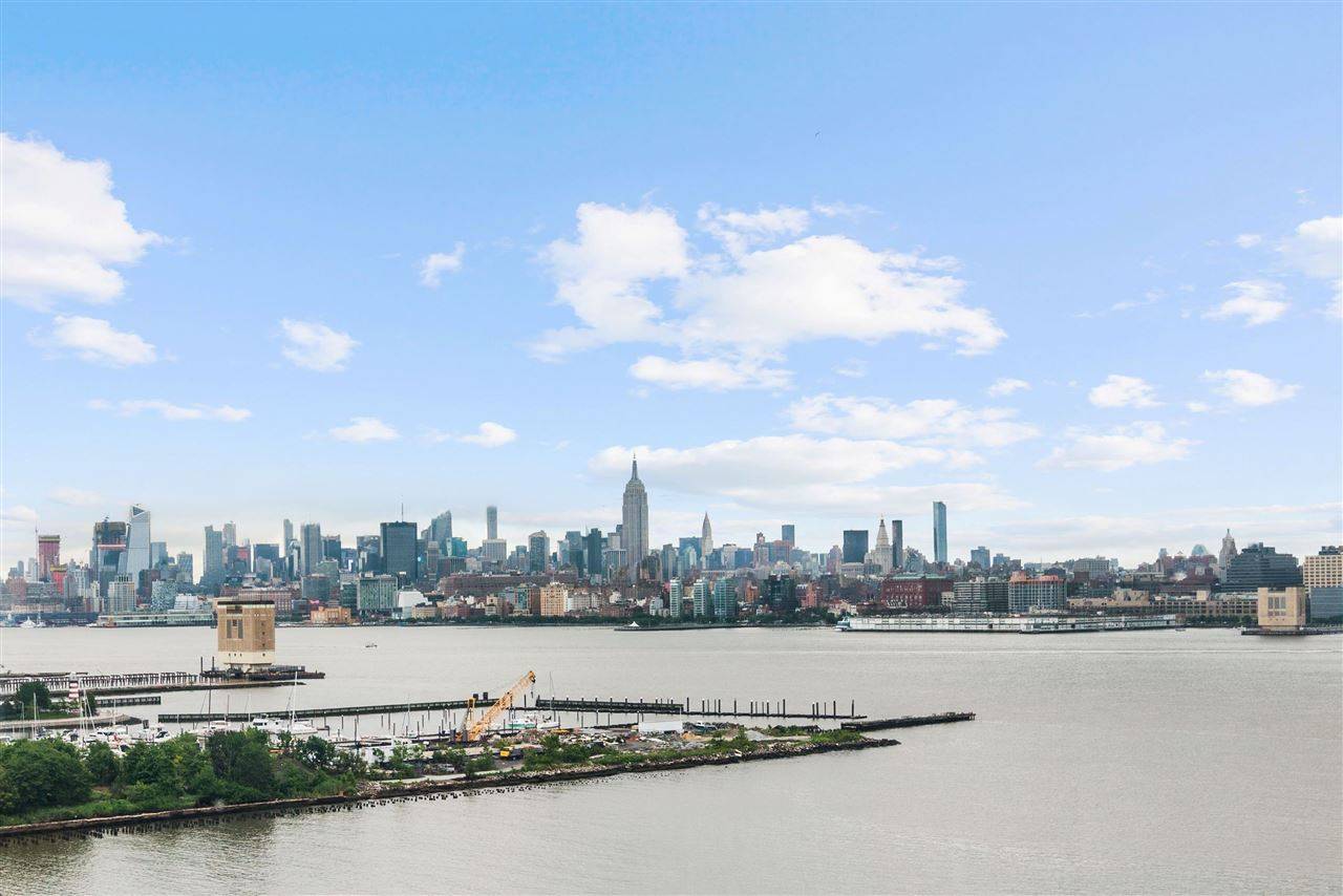 Come home to this beautifully updated 2 bed/2 bath with panoramic views of NYC & the Hudson River
