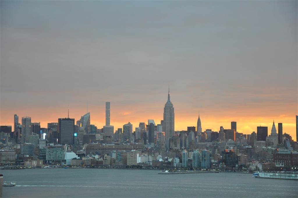 Come home to this beautifully updated 2 bed/2 bath with panoramic views of NYC & the Hudson River