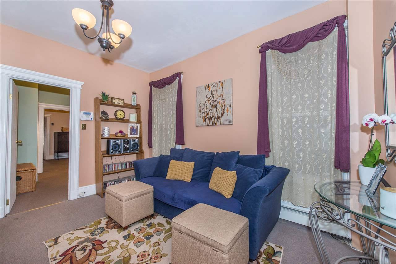 Over-sized one bedroom or two bedroom railroad with beautiful bay window