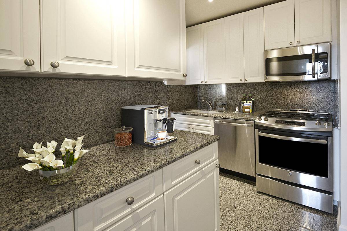 Midtown East Convertible  2 bedroom 2 bath,  Great Closet Space, Dining Room, 2 WIC's, EIK, Full Service Luxury Building, No Fee