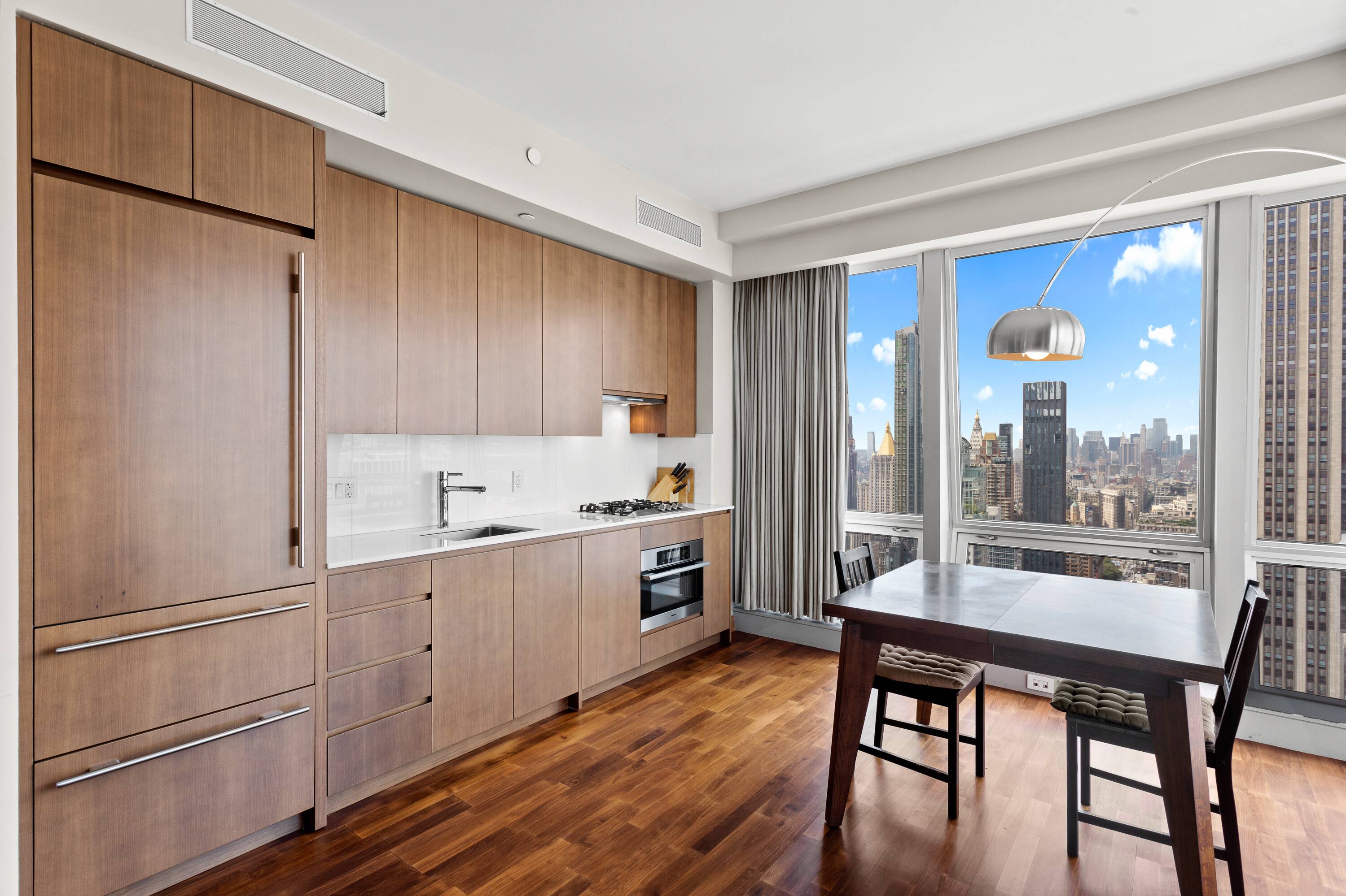 Fully furnished 1 bedroom, 1.5 bath condo with plenty of natural sunlight and spectacular views of the Empire State Building and Hudson River