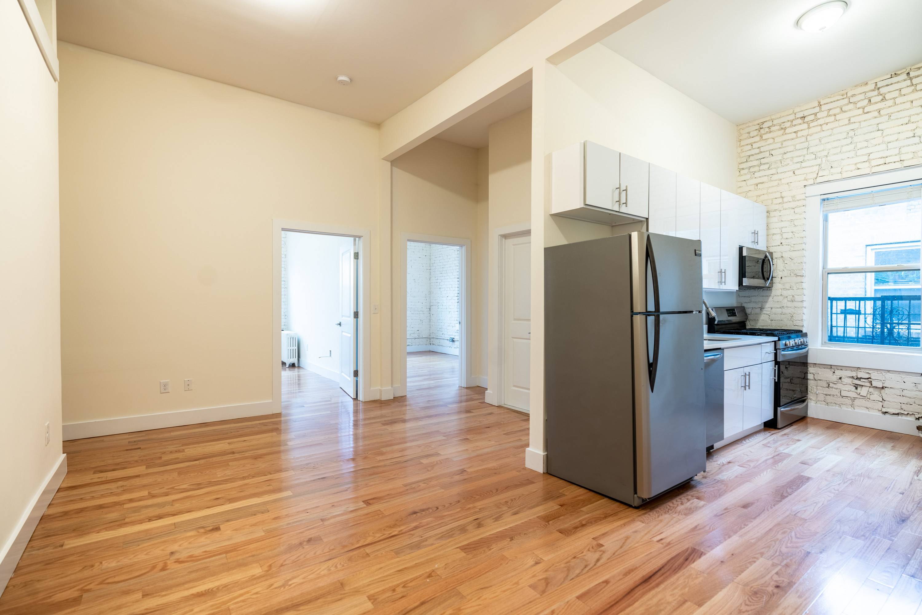 Stunning Top Floor Renovated 2BR with 11' Ceilings located Across the Street from the Journal Square Transportation Center and Path Station! Laundry On Site, On Site Super, No Broker Fees.