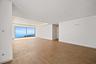 Penthouse living and dining area ocean views