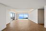 Penthouse living and dining area ocean views