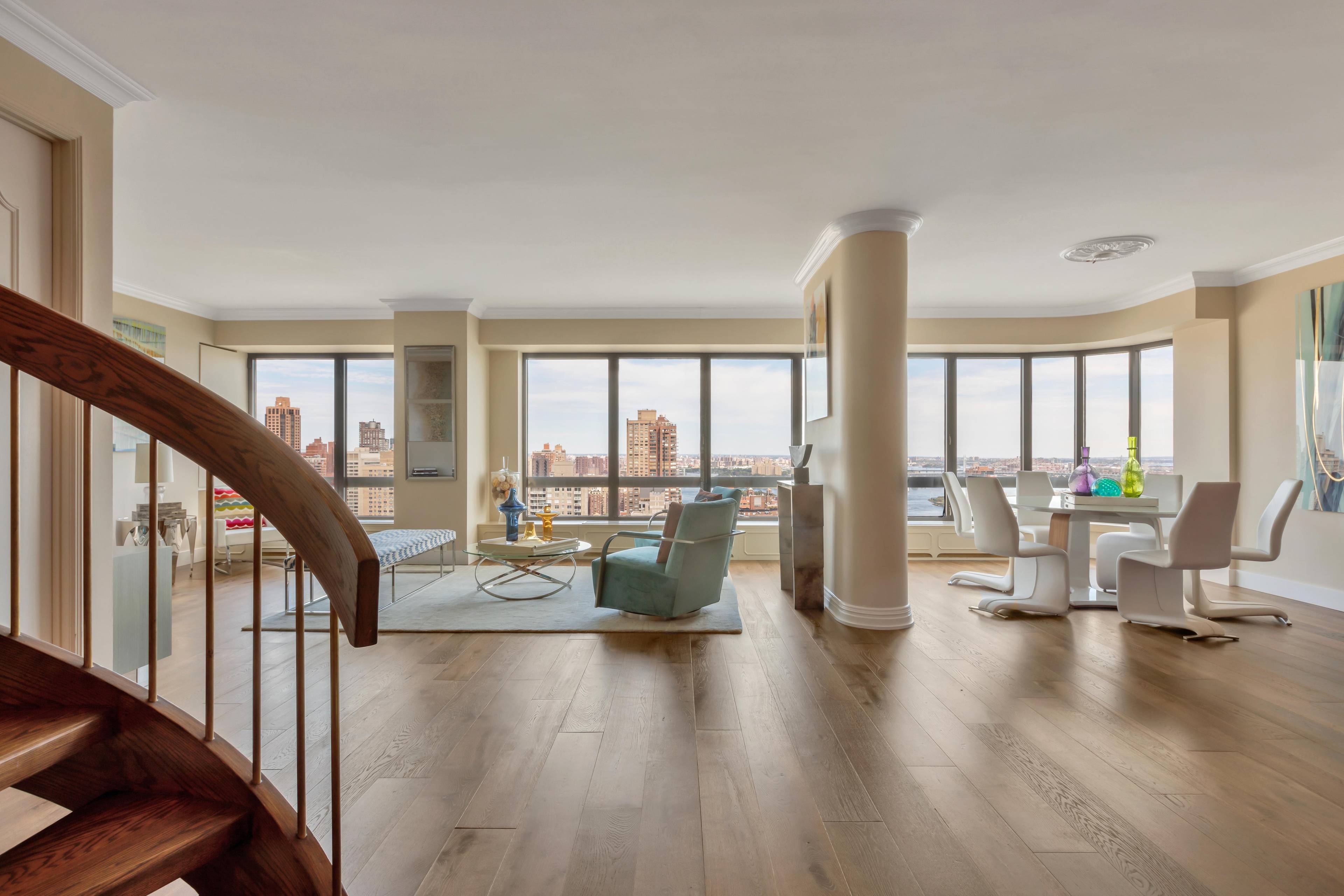 4-Bedroom Penthouse Duplex Condo with Panoramic River Views through Wall of Windows