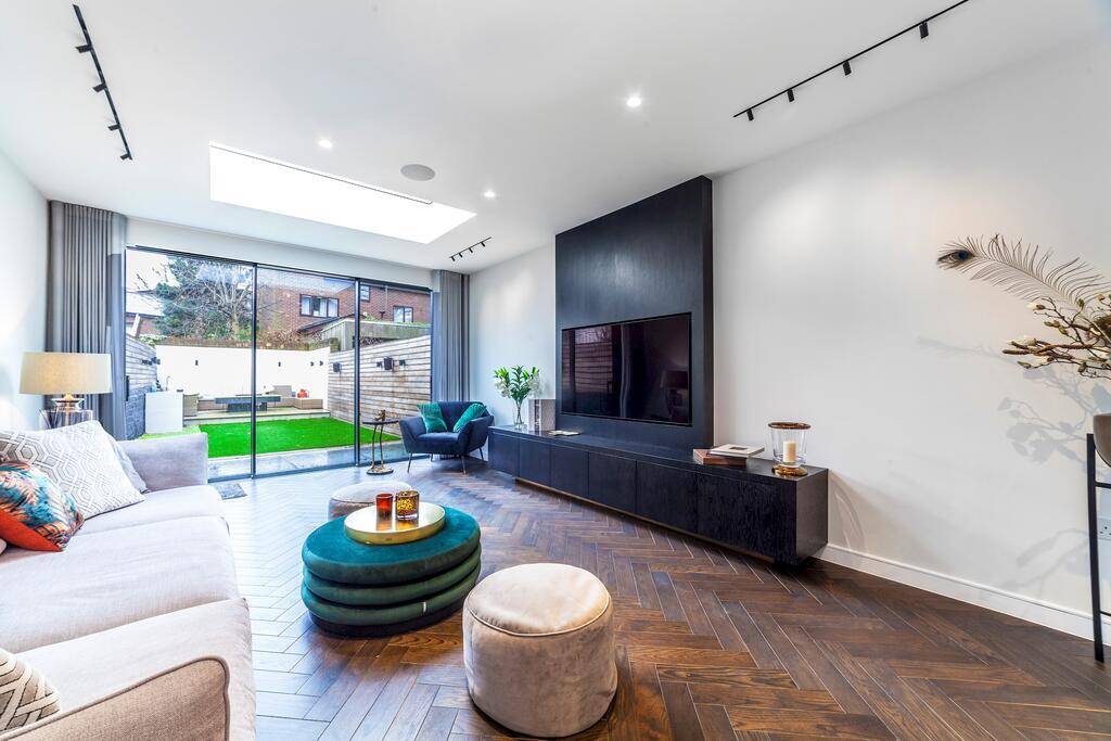 Impressively modernized three-bedroom nearly 2,300 square feet family home with high-end contemporary interior set in a highly desirable Battersea.