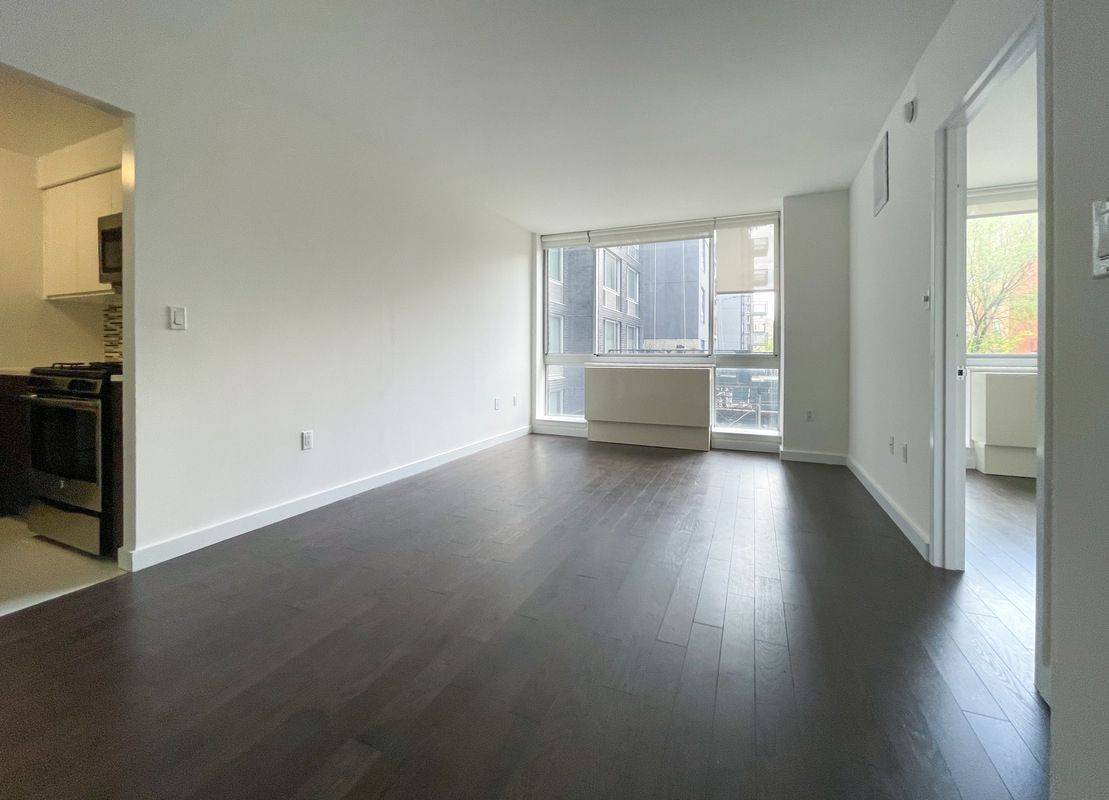 No Fee, Bright & Spacious 1 Bed/1 Bath in East Village, Brand New Hardwood Floors, W/D in Unit, Garage Parking, Furnished & Landscaped Roof Terrace & 2nd Floor Patio W/ BBQ