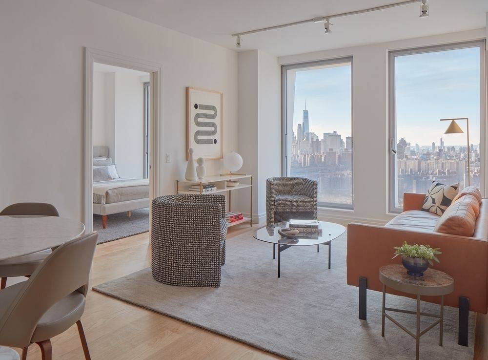 WATER VIEWS ABOUND FROM THE FLOOR-TO-CEILING WINDOWS OF THIS SUN-FLOODED 1BR OVERLOOKING THE EAST RIVER AND MANHATTAN SKYLINE.