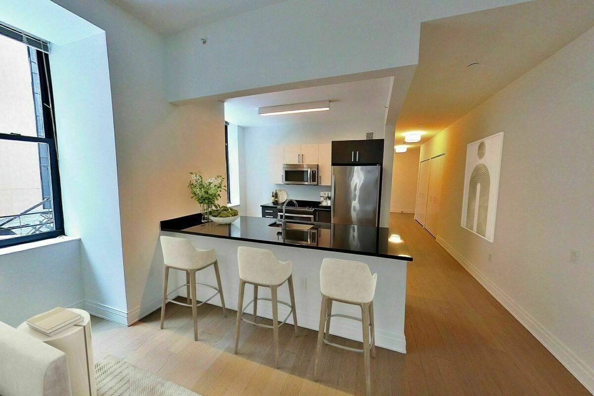 Financial District Corner Oversized Alcove Studio + HO with Tons of Windows, Chef's Kitchen, High Ceilings, W/D, No Fee
