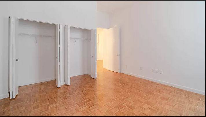 SPACIOUS STUDIO WITH 14 FT LOFTED CEILINGS IN HISTORIC FINANCIAL DISTRICT BUILDING