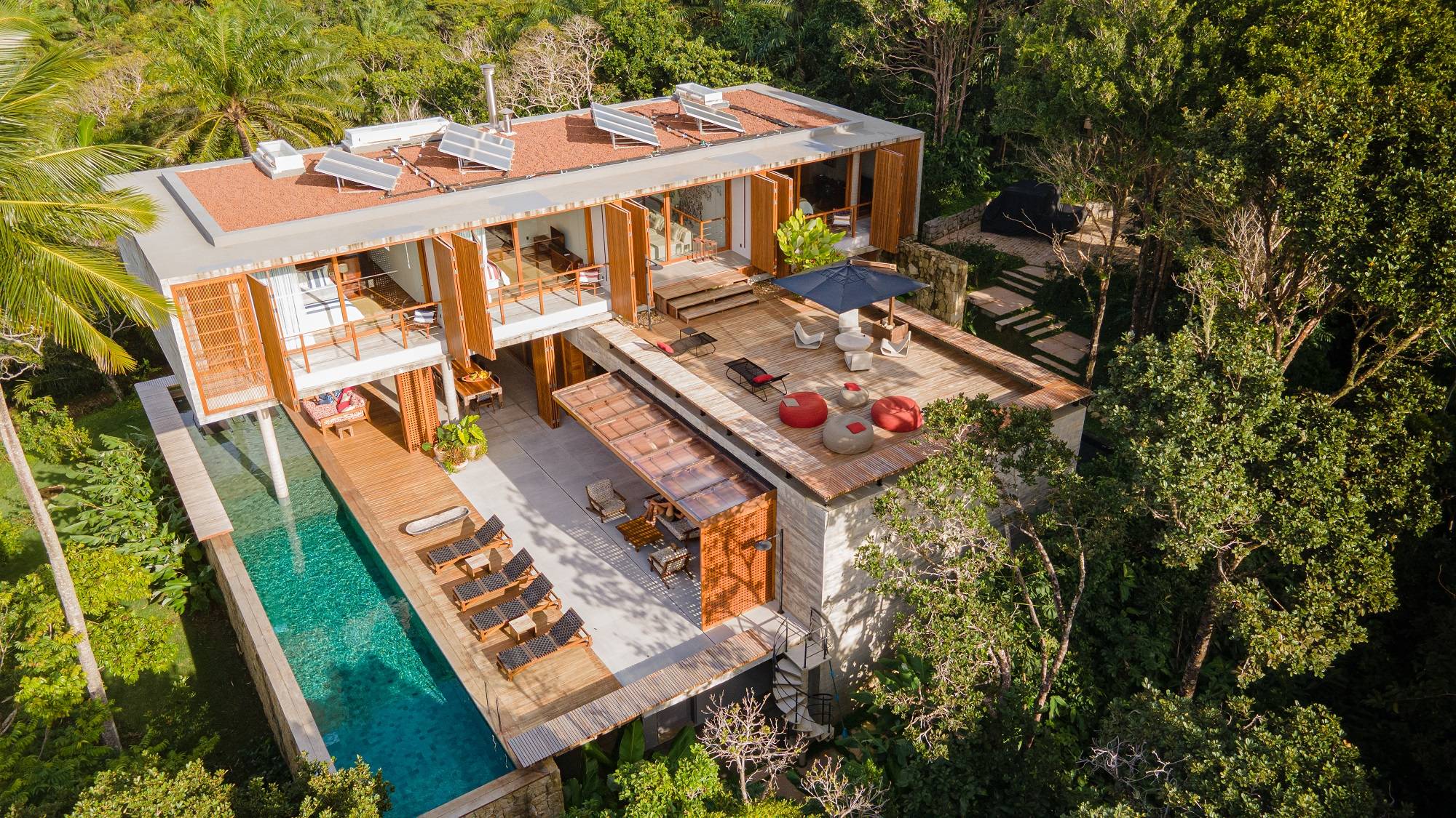 Introducing a 4-Bedroom Villa at Condominium Barracuda Hotel & Villas, Itacaré, Brazil. Seamlessly uniting Atlantic Forest's pristine charm with the expansive open sea, this villa epitomizes a rare fusion of nature and luxury.