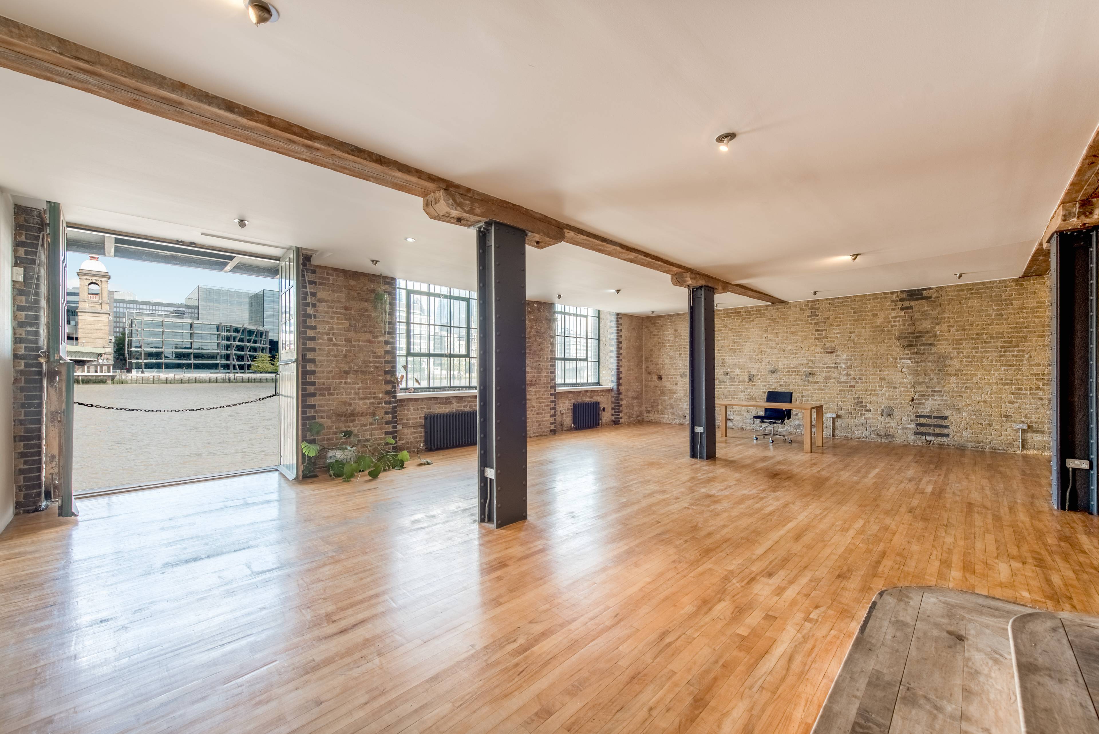 A simply massive riverside loft apartment offering epic lateral space and hard to beat views sitting directly on The River Thames by trendy Borough Market. Clink Street, London Bridge.