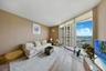 one-miami-east-3110-living-room-bay-view-floor-ceiling-glass-hardwood