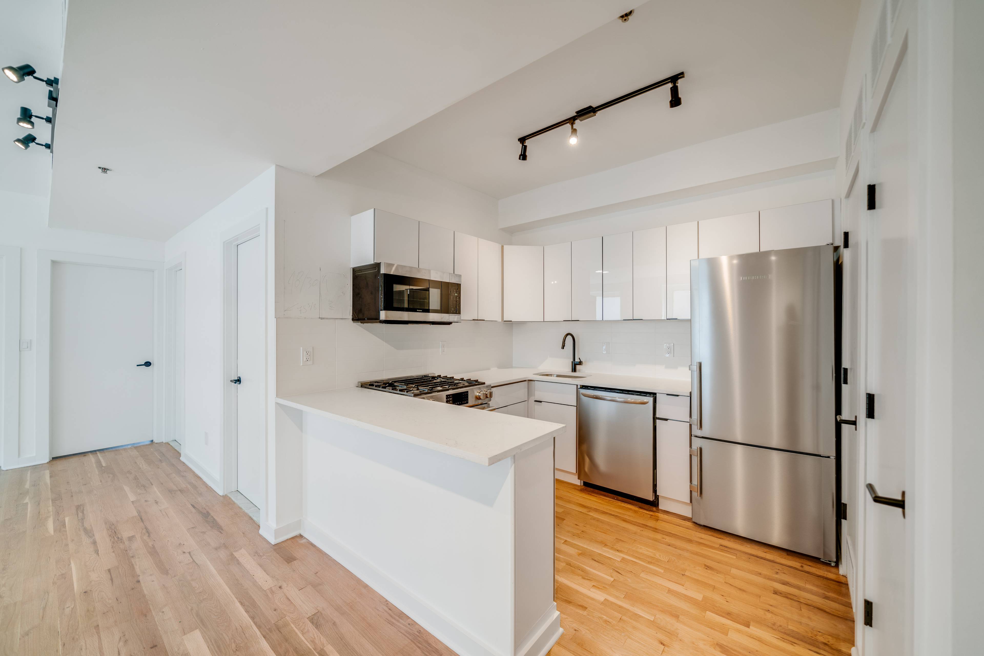 Unit 202 at 716 Madison Street! Brand New Renovation.  Laundry in Unit!  Central AC & Heating.