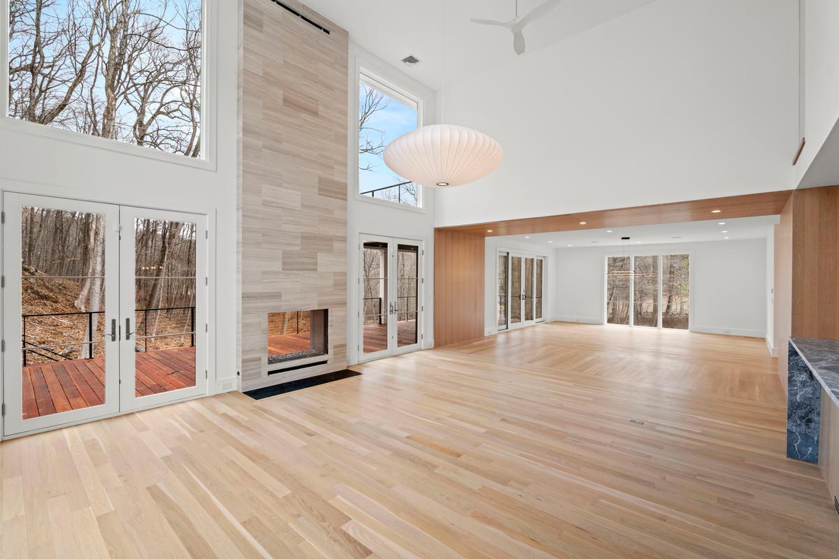 Open living space with indoor and outdoor fireplace