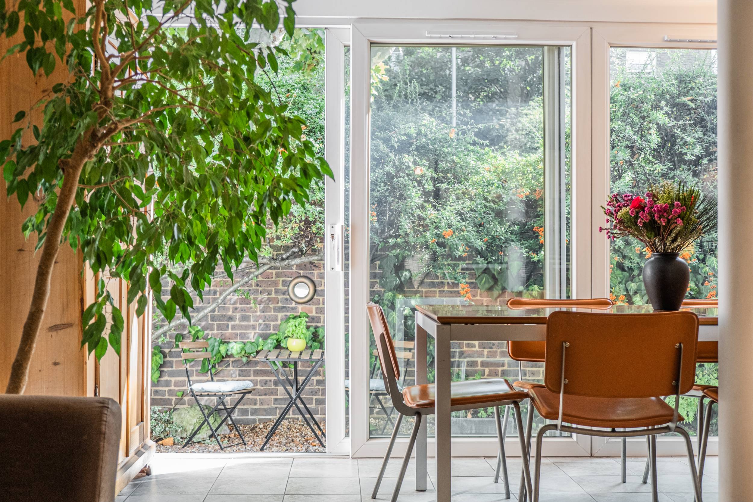An attractive and extra bright 4 bedroom terraced family house in Holland Park, arranged over 3 floors (1978 sq ft) and presented in excellent condition.