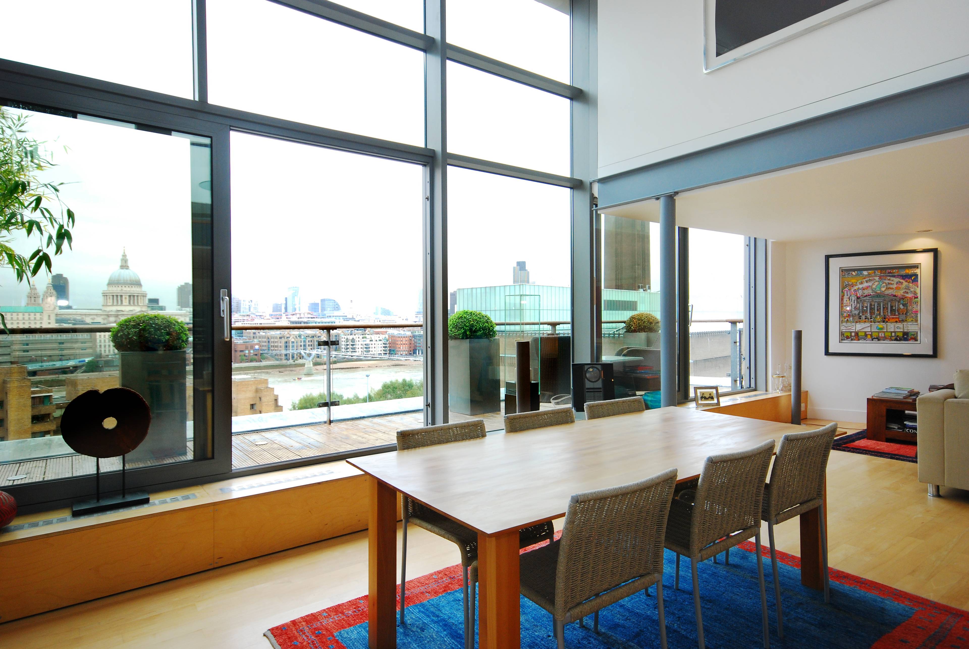 A fantastic interior designed penthouse apartment next to the Tate Modern provides residents with fabulous views of the River Thames and St Pauls Cathedral.