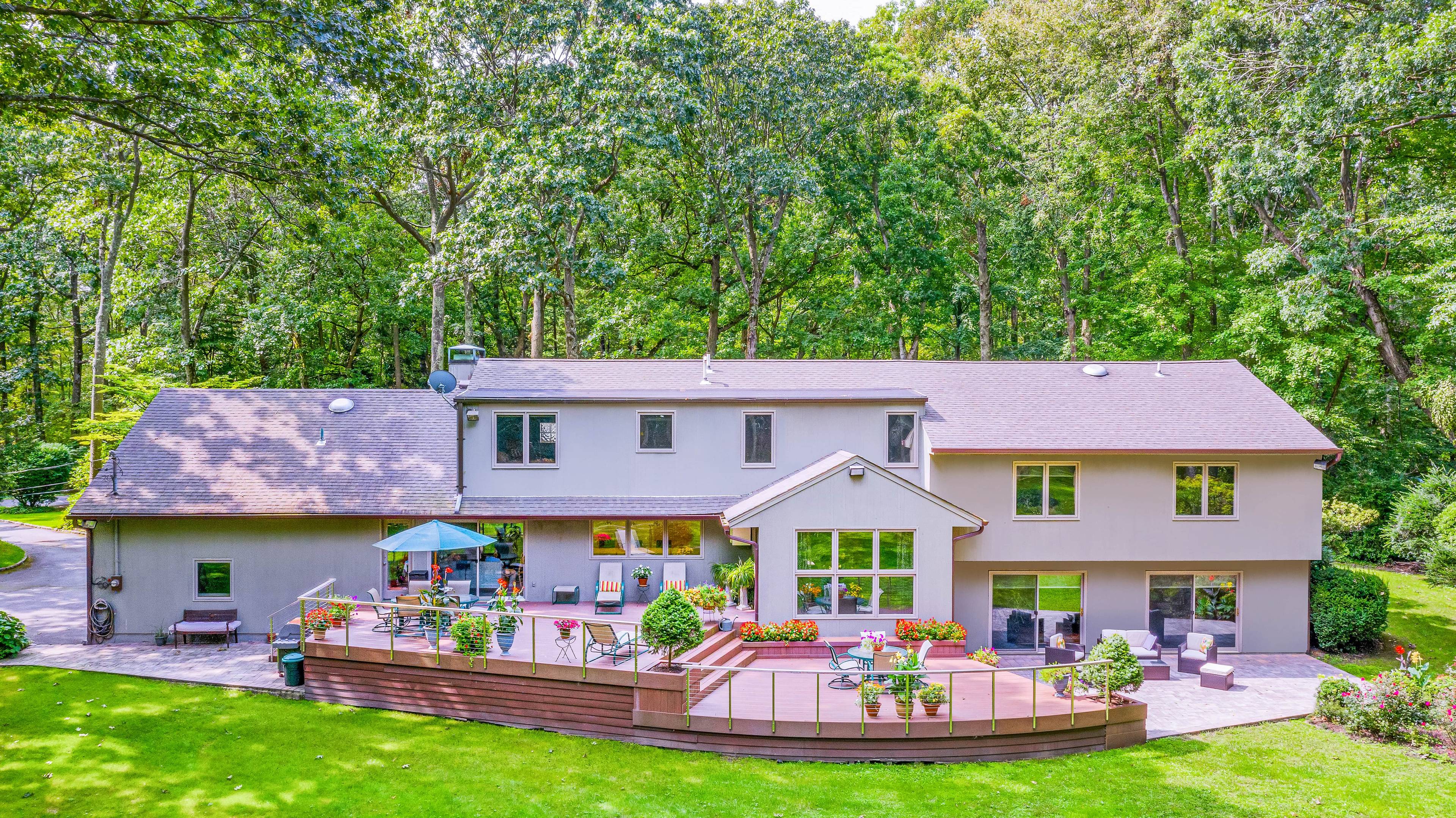 Modern Farm Ranch Home Nestled on 2 Park-Like Acres in Muttontown