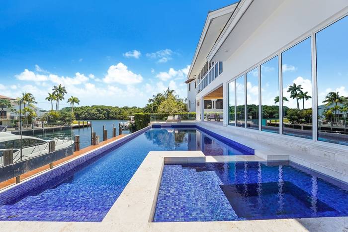 MIAMI'S MOST SOUGHT AFTER NEIGHBORHOOD| 5 Bed |5 Bath | 3 Car Garage Pool Boat Dock | Total of 8,763 sf | PRICE TO SELL!!