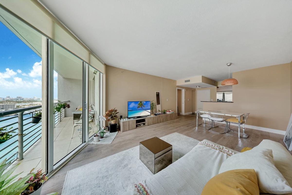 one-miami-east-3110-living-room-bay-view-floor-ceiling-glass-hardwood