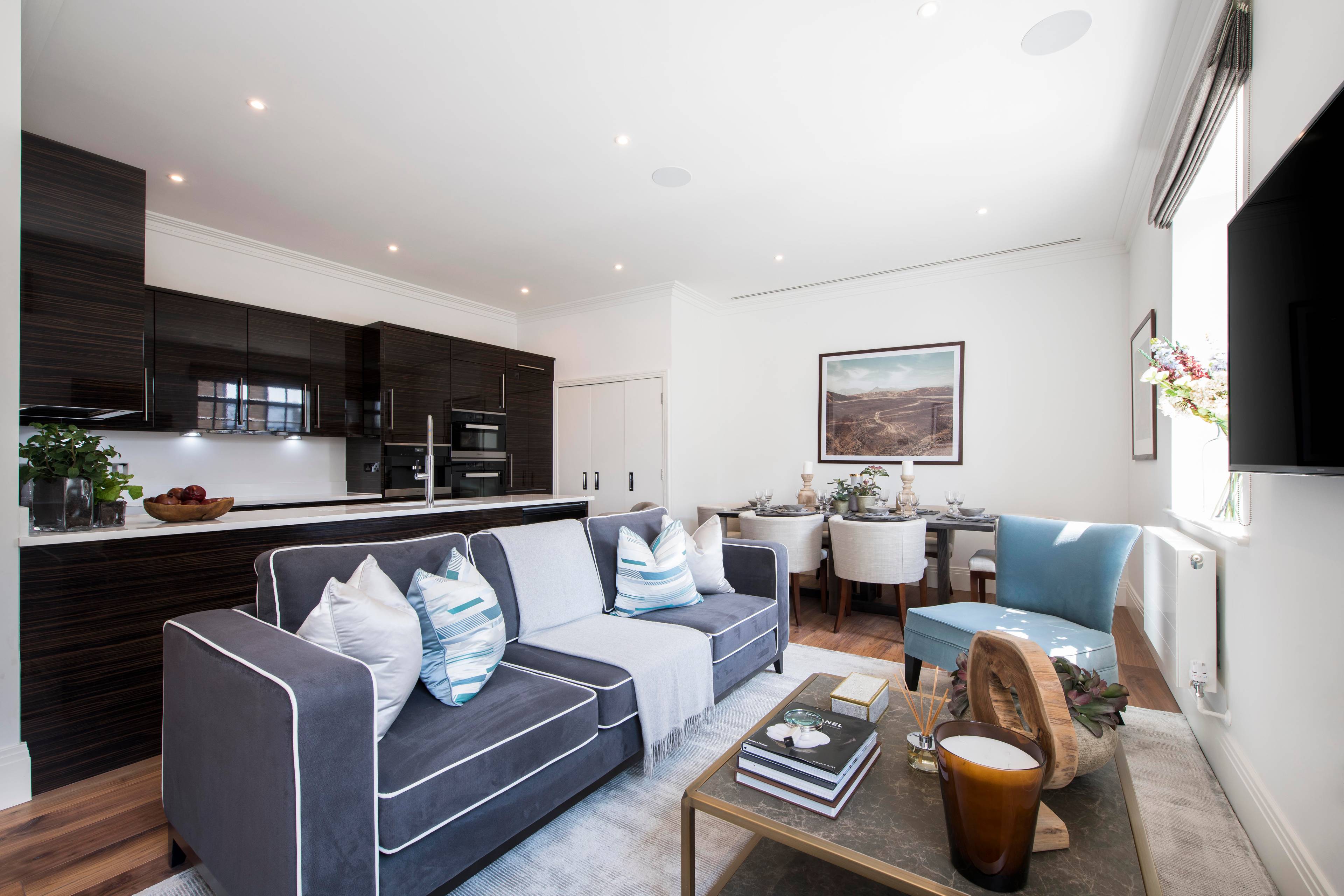 A spectacular duplex interior designed three bedroom, three bathroom apartment with a private balcony and roof terrace, offering stunning views of the River Thames and set within this newly converted, warehouse style, gated development.