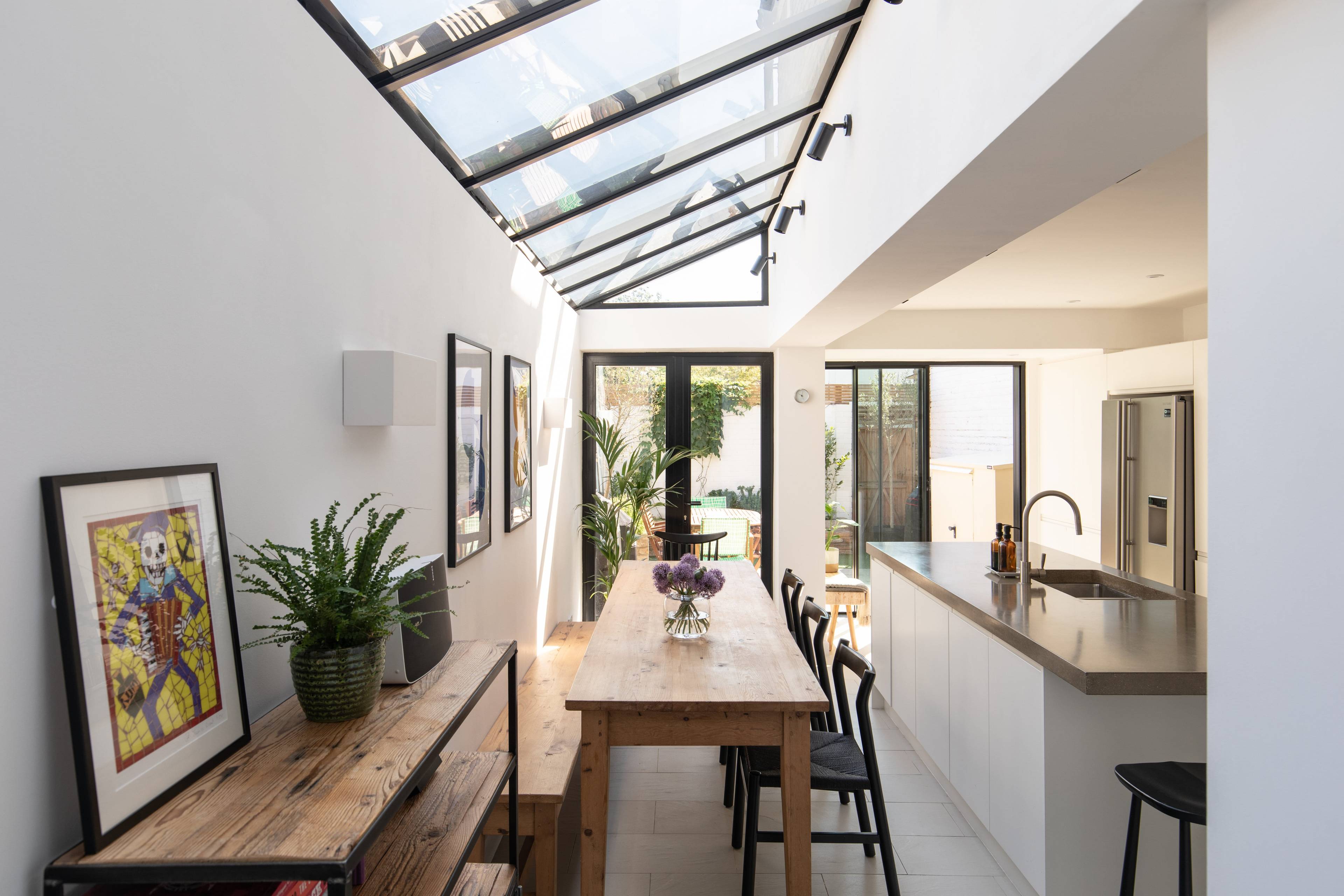 Stylish four bedroom family home with beautifully extended kitchen/diner, exposed brickwork  and low maintenance garden  in the heart of buzzing Peckham Rye.