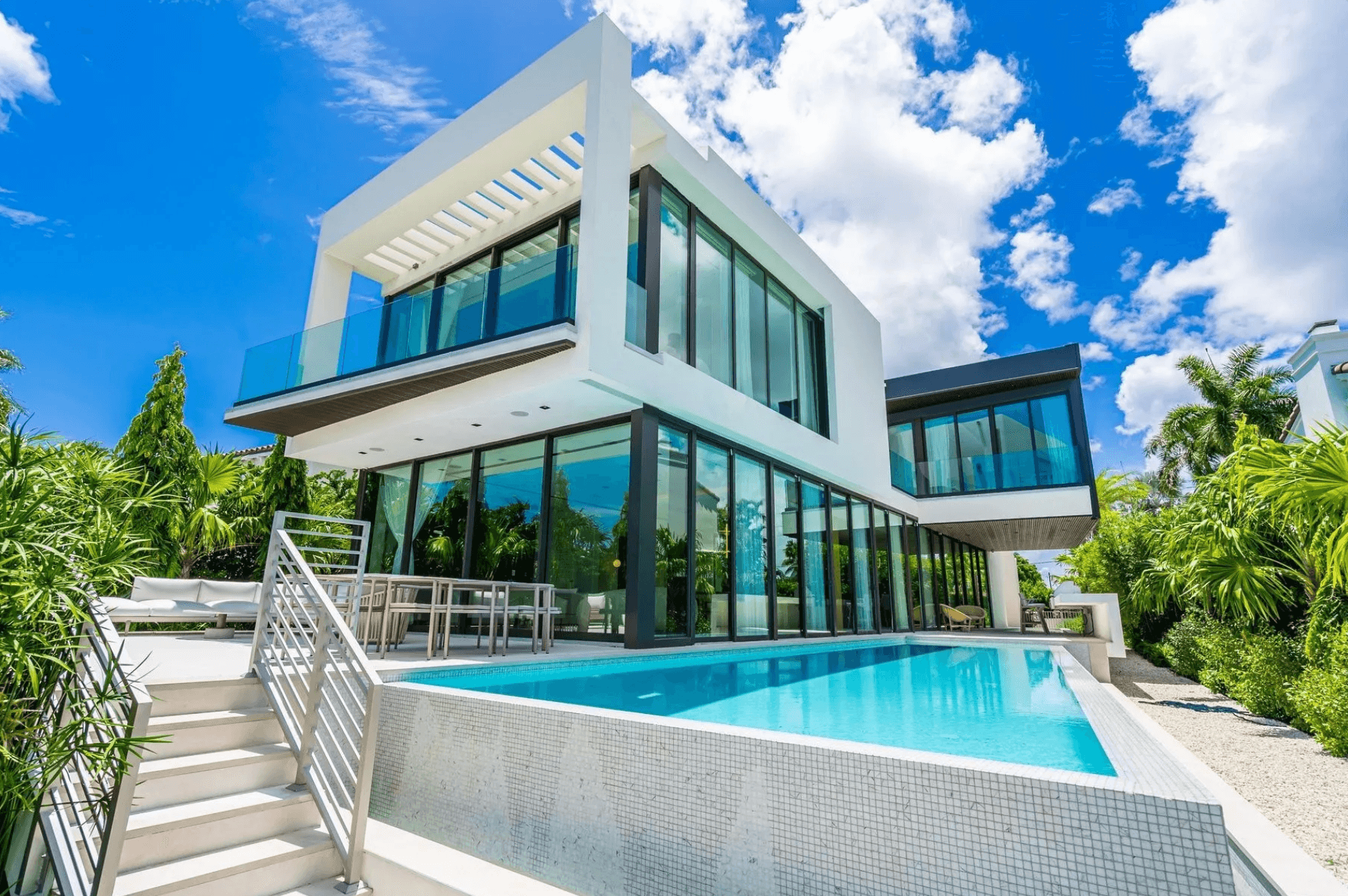 Sophisticated Waterfront Oasis: Residence on Hibiscus Island with Stunning Views and Infinity Pools | 5 Beds | 5 Baths | 5243 sqft