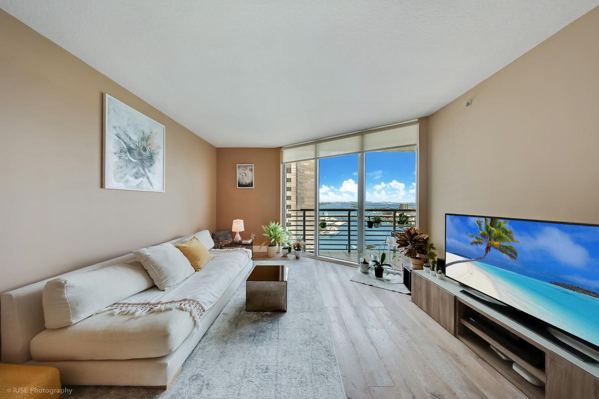 one-miami-east-3110-living-room-bay-view-floor-ceiling-glass-hardwood